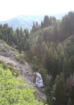 View of Grove Creek Falls, with Timpanogos in the background. The white spots at...