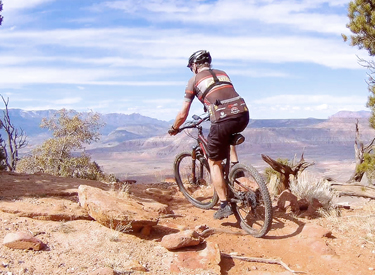 Retired Doctor Bruce rides the cliff of the North Rim in March 2020. Original tr...