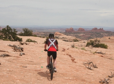 Back on Navajo Sandstone. Were looking east toward spires of Entrada.