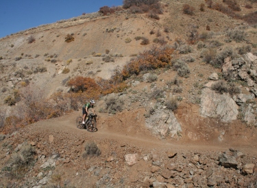 Mitt rolls around an outcrop of limestone on Rattler.