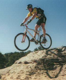 Matt Flygare takes a shortcut on the South Rim Trail. Photo August 5, 2000