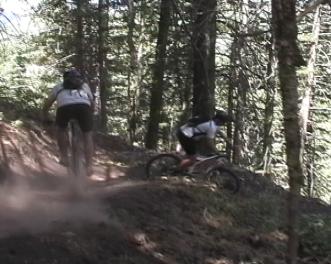 Chad and Dominic rocket around a switchback in the pines, on the Boneyard Trail....